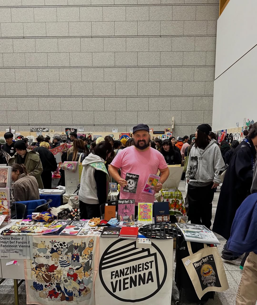 Deniz tabling at Tokyo Art Book Fair with Fanzineist Vienna materials in December 2025