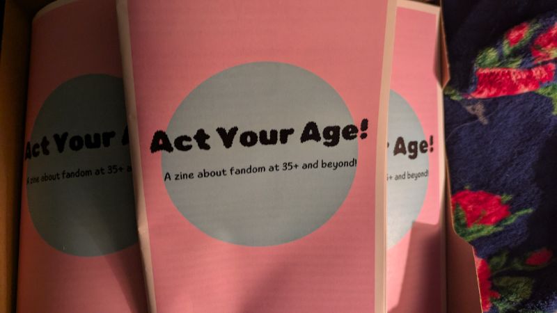 Act Your Age: A zine about fandom at 35+ and beyond cover